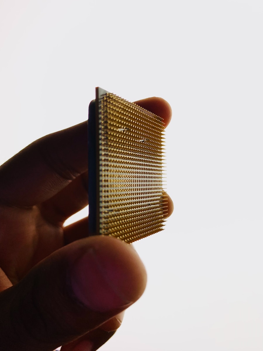 a close up of a person holding a comb
